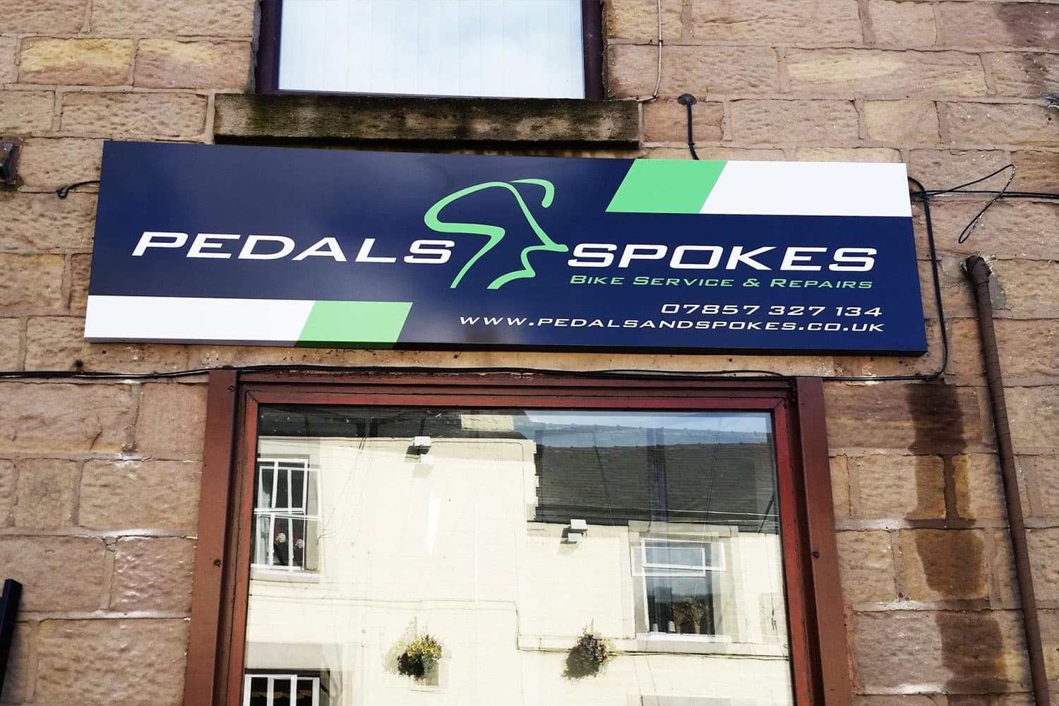 Pedals and Spokes printed flat panel sign