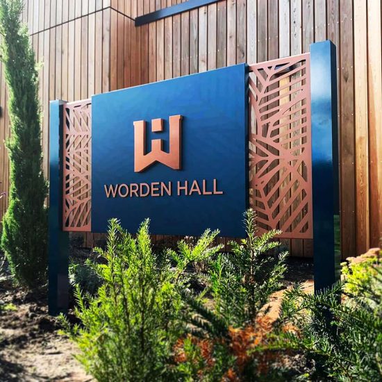 Worden Hall - powder coated ali-comp with digitally printed vinyl wrapped laser cut letters post sign closeup