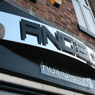 Angels Hair Company - stand-off letters on curved reflective sign tray.