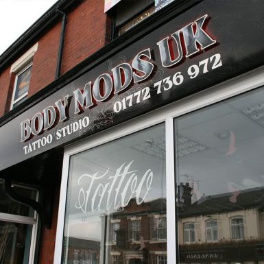 Body Mods Tattoo - shop sign flat panel with stand-off letters and window graphics.