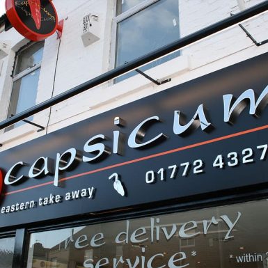 Capsicum Take-away - circle light box with built up 3D stainless steel letters and trough light.