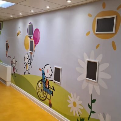 Derian House messy play area with digitally printed vinyl wallpaper