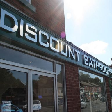 Discount Bathrooms - shop sign with built up 3D stainless steel letters.
