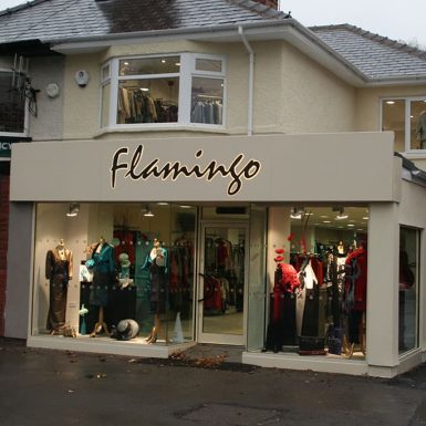 Flamingo shop - internally illuminated sign tray with flat cut letters.