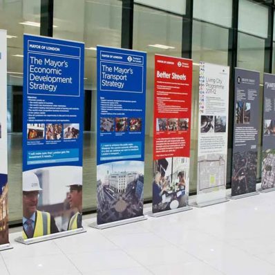 Colourful roller banners lined up in lobby of building