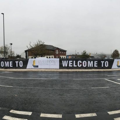 Digitally printed PVC banners with eyelets opposite the road promoting Liverpool Shopping Park