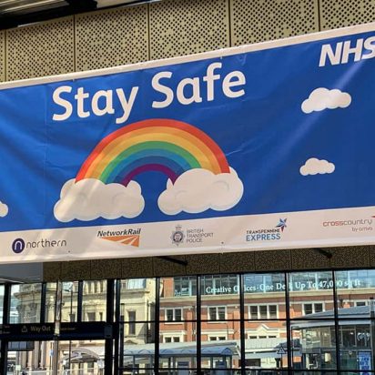 NHS Stay Safe campaign banner made of digitally printed PVC material displayed at the station