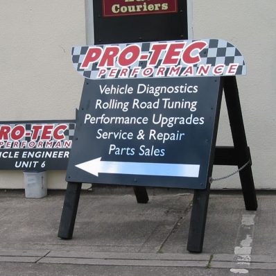 Custom shaped wooden a-board featuring digitally printed cut vinyl from Pro-Tec Performance.