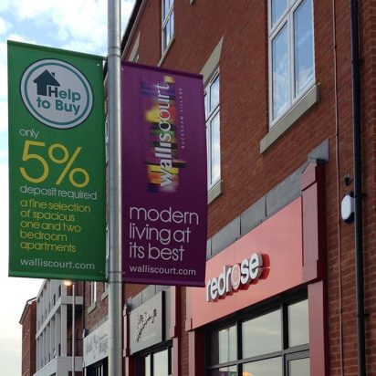 Double sided digitally printed PVC banners on projecting arms at Red Rose Buckshaw Village.