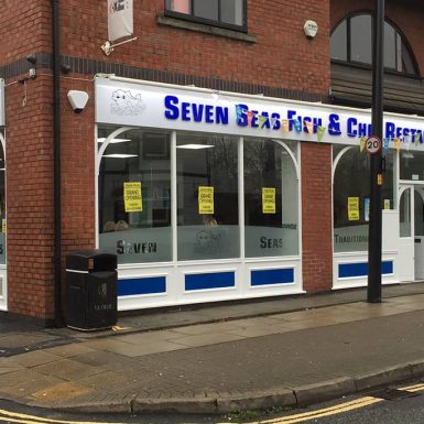 Seven seas fish and chips shop - aluminium sign tray with mounted flat cut acrylic letters and led trough lights.