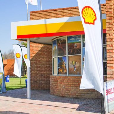 Shell petrol station feather flying banner with reinforced elasticated black pole sleeve and tank base