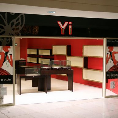 Yi shop - sign tray with internal illumination and built-up chrome letters.