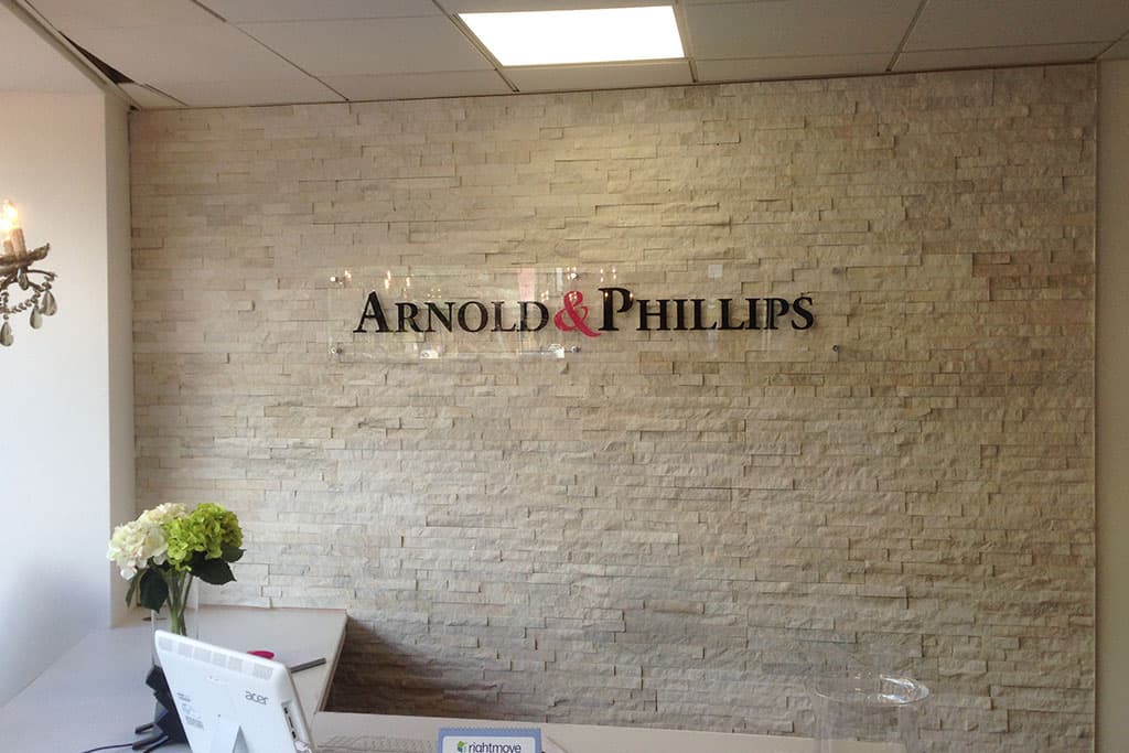 arnold-and-phillips-internal-clear-acrylic-plaque-with-cut-vinyl-text-mounted-on-chrome-stand-offs Arnold & Phillips - internal clear acrylic plaque with cut vinyl text mounted on chrome stand-offs