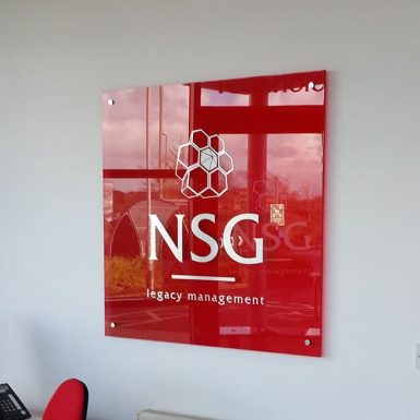 NSG Legacy Management - red acrylic plaque with digitally printed cut graphics mounted on chrome stand-offs