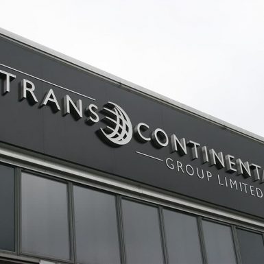 Trans Continental - built up 3D stainless steel letters with face lit LED illumination warehouse sign