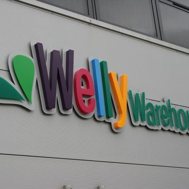 Welly Warehouse - built-up and flat cut acrylic letters mounted on an aluminium panel