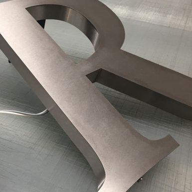 3D built-up letter R satin stainless steel finish illuminated