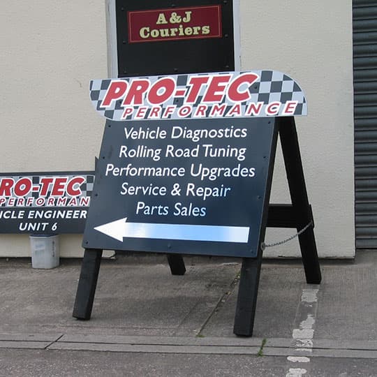 Custom shaped wooden a-board featuring digitally printed cut vinyl from Pro-Tec Performance.