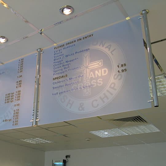 Interior frosted hanging sign menu banner A frosted hanging sign menu displayed on an interior wall