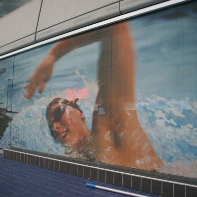 Manchester Aquatic Centre Training Camp - digitally printed one-way vision film contravision window graphics