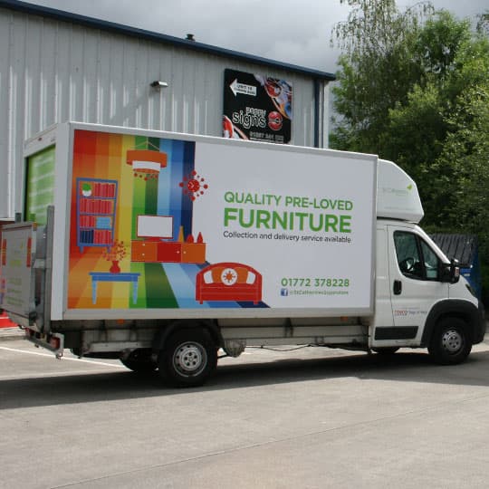 Digitally printed commercial vehicle graphics on side banner Commercial truck in parking lot, showcasing digitally printed graphics