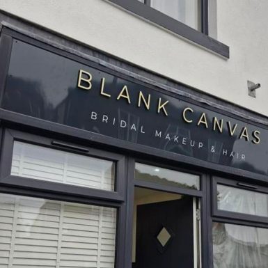 Blank Canvas - brushed gold ali-comp flat cut letters on 10mm black foam PVC to reverse and-white vinyl cut letters flat panel sign