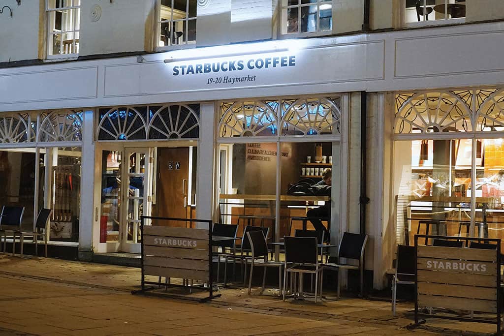 Starbucks Coffee Restaurant with illuminated flat panel sign and external barrier branding