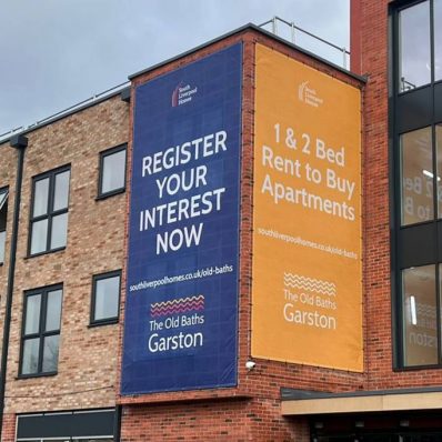 South Liverpool Homes - digitally printed 1x large 3370 x 6380mm mesh building banner using tensioned wire system