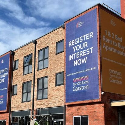 South Liverpool Homes - digitally printed large 3x mesh building banners using tensioned wire system