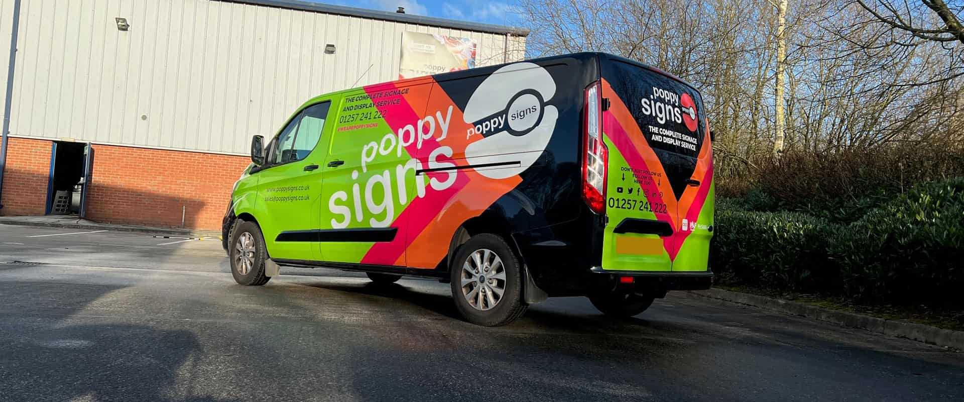 Poppy Signs vehicle with graphics and chapter 8 reflective 